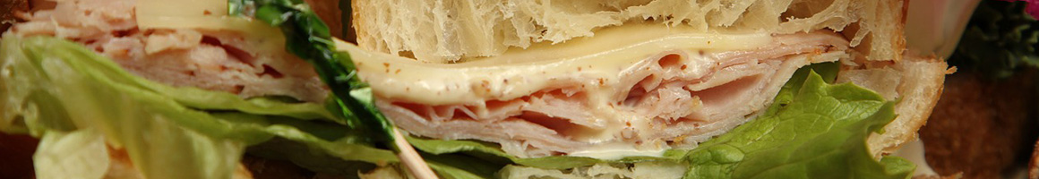 Eating Greek Pizza Sandwich at Italian Tasty Foods restaurant in Peabody, MA.